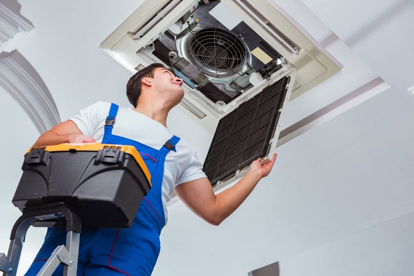 man performing heating repairs in westminster 